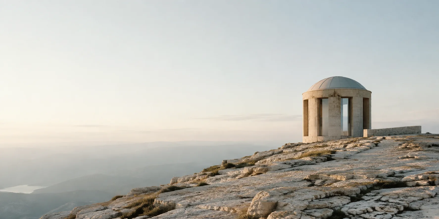 A restrained stone observatory beneath an open horizon.